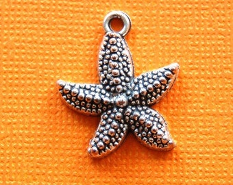 12 STARFISH silver charms or pendants . 22mm x 19mm chs0699