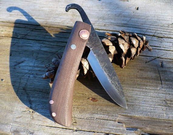 Items similar to Hand forged friction folding knife: File steel/walnut ...