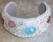 bead embroidered cuff bracelet with Larimar, ruby and quartz