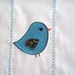 Burp cloth with a cute little blue and brown bird. It can be personalized for an extra charge.