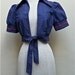 Adorable 1970's Bolero/Cropped Short Sleeved Jacket in Blue denim with Red rickrack - Bandana tie in front - size small