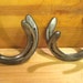 Wall hooks for coats, brooms, shovels