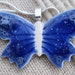 Porcelain butterfly pendant on silver plated chain