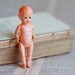 Serious little Baby - Antique Tiny Plastic Doll with Jointed Limbs
