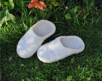 Felted slippers from natural wool, white.