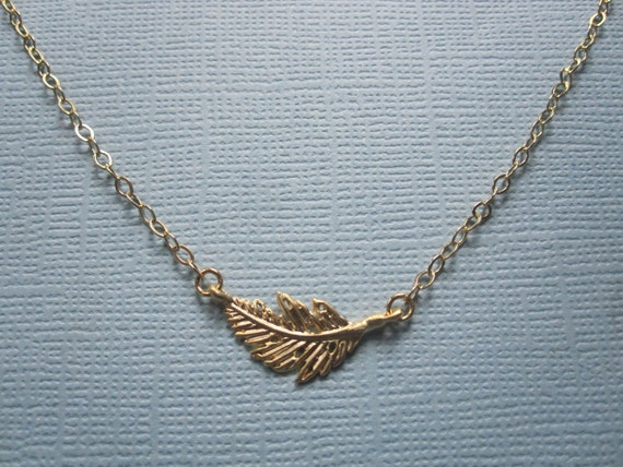 Items similar to Delicate Sideways Small Feather Necklace available in ...