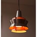 Danish modern hanging lamps, set of 2. Eames era. 1960s 1970s. Orange and aluminum. Beautiful lighting.