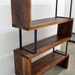 Modern Walnut wood and steel ribbon bookshelf