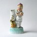 Antique porcelain vase, porcelain figurine of a girl