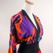 Vintage Olga palazzo jumpsuit 1970s abstract psychedelic color block print. Retro Halloween costume