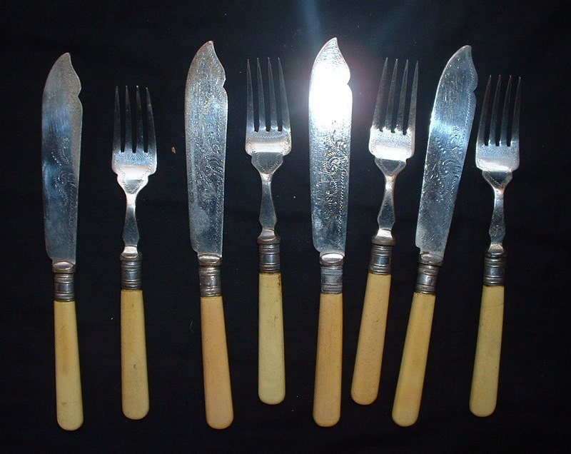 antique set of 4 fish knives and forks