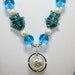 Beaded Necklace In Aqua Blue with Pearl and Lampwork Fish with Silver Spinning Globe Pendant