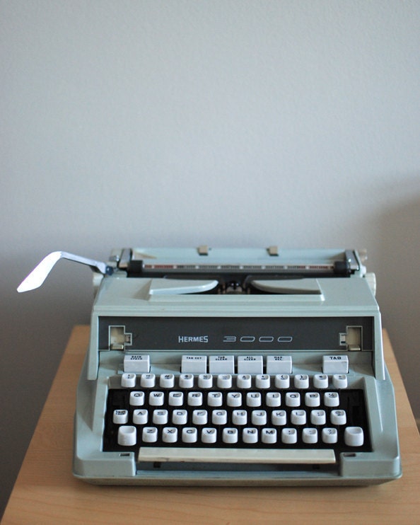 Vintage Hermes 3000 typewriter with original carrying