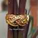 Orange and yellow sapphire and cognac diamond ring by Kay Knight