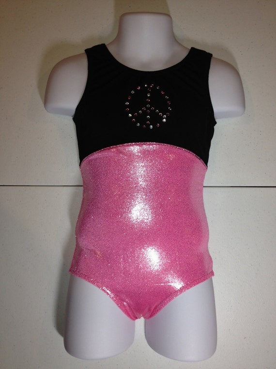 It's free shipping made easy Perfect for gymnastics, dance class, recitals, ballet, Halloween costumes, and flower girl dresses. Adorable styles include our ruffle flutter short sleeve or long sleeve leotard, traditional short sleeve or long sleeve leotard, camisole leotard, or tank leotard. 23 colors including white, ivory, nude, black, and pink.
