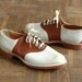 r e s e r v e d vintage 1940s saddle shoes / deadstock brown and white saddle shoes / size 9