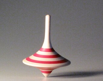 Red striped funnel shaped spinning top
