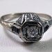 HOLDING --Art Deco Antique 18k .26 carat Old European Cut Diamond and Four Baguette Sapphire Ring