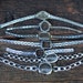 Lot of 7 vintage small watch cases with metal strap.