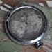 Antique pocket watch case with movement and dial.