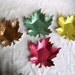 Anodized aluminum ashtrays mid century colorful green gold red bronze shaped oak or maple leaf