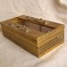 Hollywood Regency tissue box holder gold plated with two rows of roses
