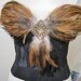 Black Bustier with Earth Tone feathers and Jeweled Diamond shaped Applique