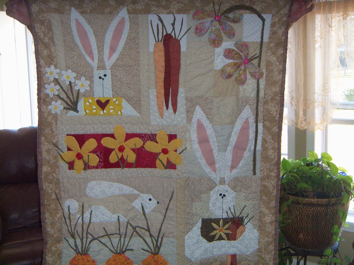 Quilted wall hanging Bunnies and applique.Carrots flowers
