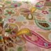 Fleece blanket camel colored fleece with multi color flowers and butterflies, other side is all camel color,