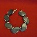 Lisner Signed Bracelet Swirling grey-black Thermoset Stones Gold tone mid century modern mad men vintage thermaset stones