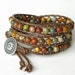 Boho chic - beaded greek leather wrap bracelet with picasso jasper beads & Tierra Cast button