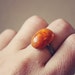 sina. a petite orange marbled cab ring.