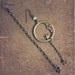 moonlight. a pair of moon and star assymetrcial brass earrings.