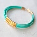 Mint Green Leather Bracelet with 6 Golden tubes by pardes israel