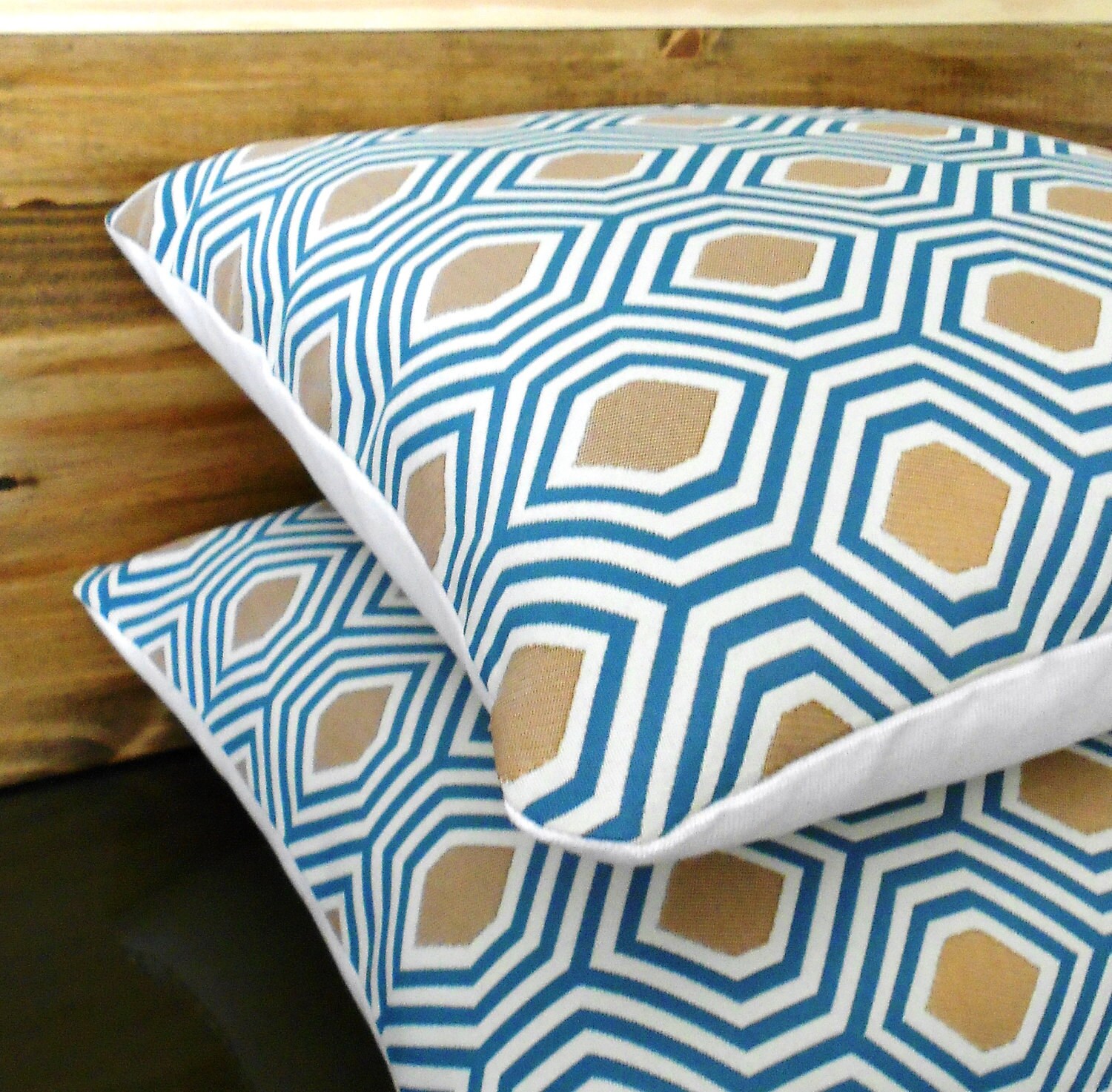 Pair of turquoise and gold geometric decorative pillows