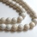 Natural Riverstone in natural ivory almond round gemstone 10mm full strand 4300GS