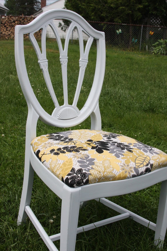 White accent chair with yellow and grey print fabric