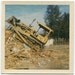 Vintage 1960s Bulldozer photo demolishing a building