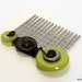 Black Hair Comb with Green and Metal Buttons and Black Wire Accents