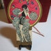 Gorgeous Rust Craft Die cut gold gilded Vampy flapper girl in elaborate costume new years theme bridge tally card