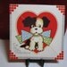 Cute 1930's-40's die cut puppy valentine wearing a polka dotted bow