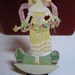 Gorgeous die cut art deco two piece place card beautiful woman in yellow dress hat carrying flowers 1921 P.F. Volland