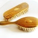 Antique guilloche engraved gold miniature baby or doll hair brushes
