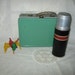 Child's tin lunch box and thermos
