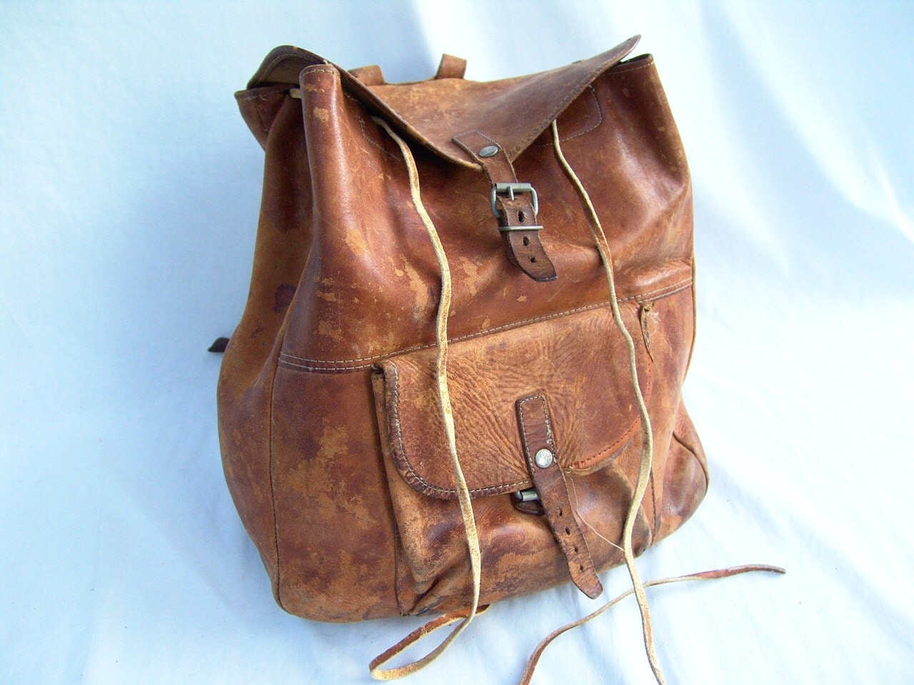 Old Distressed Leather Drawstring Backpack by PoisonPuddingFaire