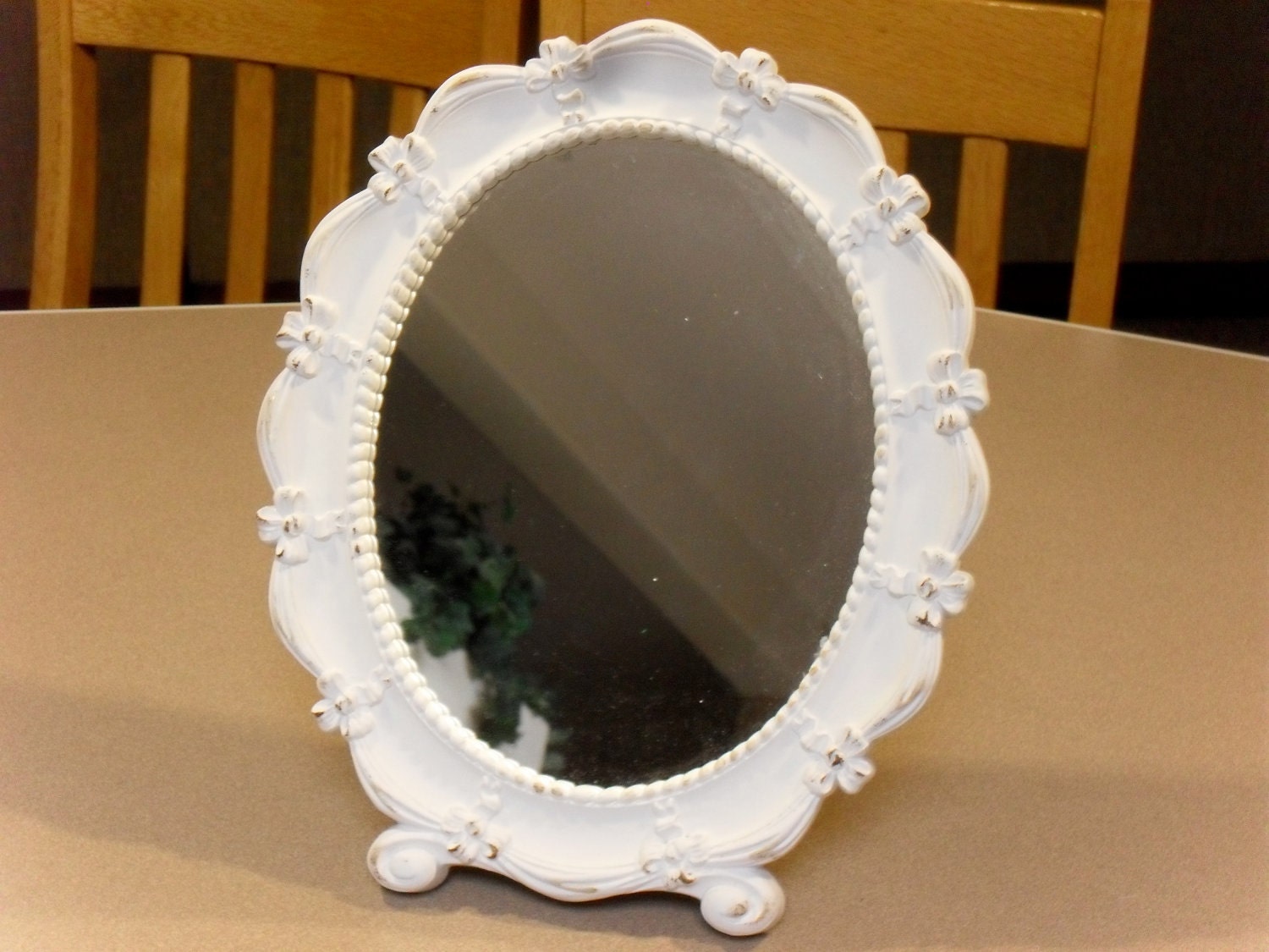 1943 Syroco Table top vanity mirror. White with gold showing
