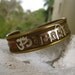 ON HOLD Sanskrit Bracelet: Om Symbol Silver Copper Brass Cuff with Red Stones Vintage 60s Hindu Buddhist Meditation Yoga