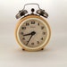 Vintage yellow alarm clock made in Russia