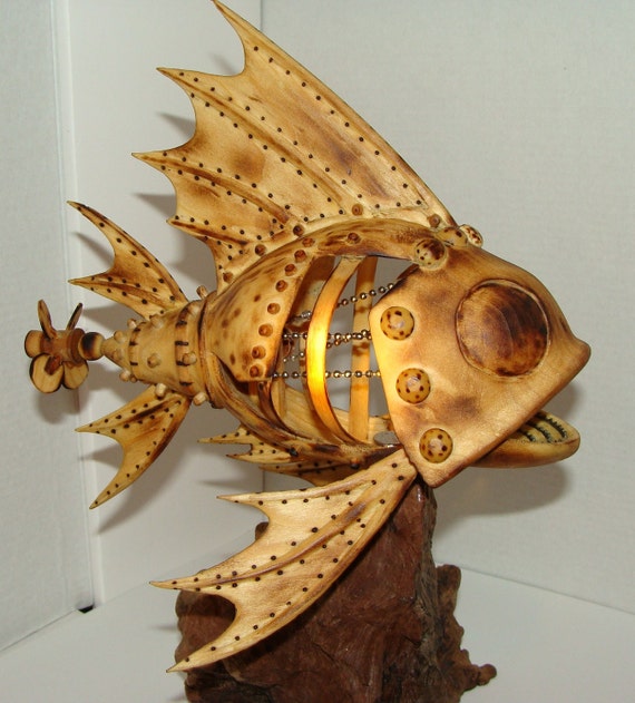 Hand carved Mechanical fish with propeller that turns by hand.