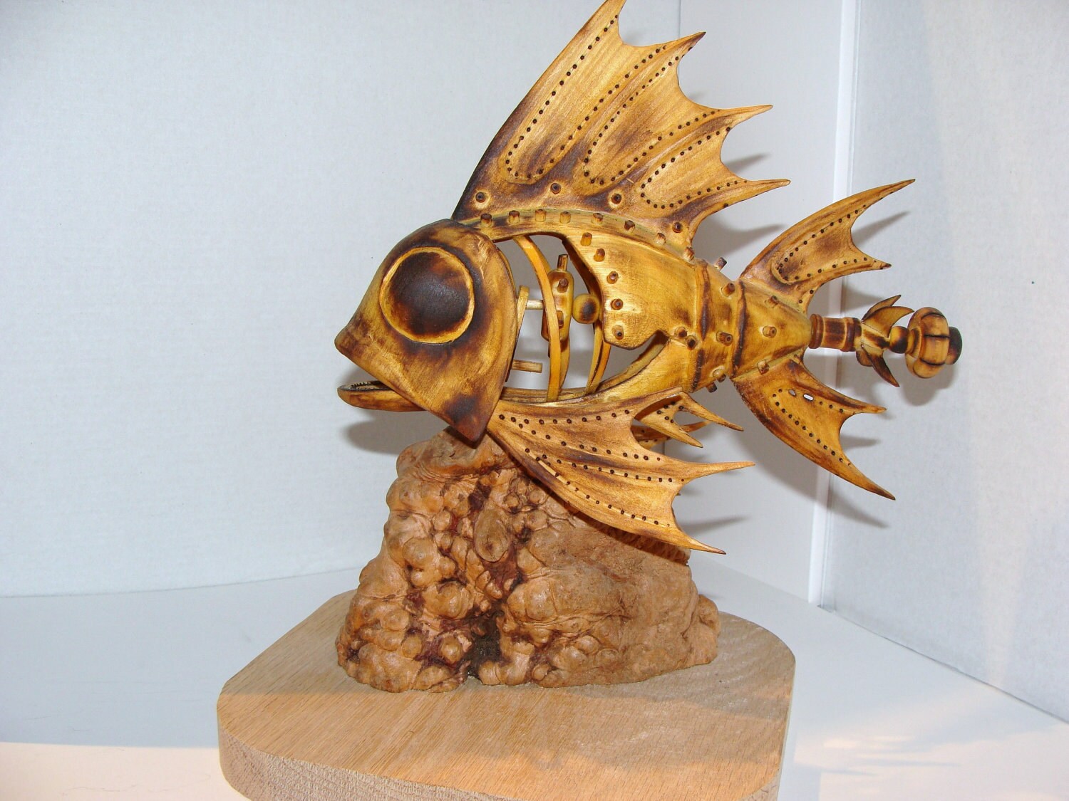 Hand carved mechanical fish with moving jaw when propeller
